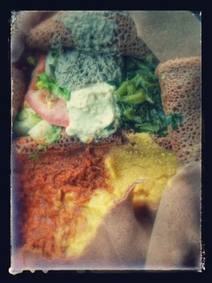 Veggie combo platter: red lentils, split peas, collard greens, salad, stuffed jalapeño on gluten free injera. Deliciously authentic Ethiopian. at Cafe Dareye in Oakland
