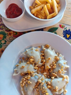 Pierogi with blueberries and french fries at Vege Bistro - Polish Vegan Food in Warsaw