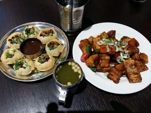 Pani Puri (crispy shells filled with chickpeas and potato) and Mogo Ho Ho (fried cassava), from vegan menu at Bhel Puri House in Reading
