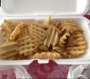 to-go order of waffle fries  at Lucky's in Scottsdale