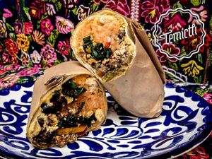 Breakfast Burrito o Burrito Mañanero.Ingredientes y tamaño perfecto para satisfacer cualquier antojo. Tortilla de maíz rellena con arroz, frijoles, queso amarillo vegano, tofu a la mexicana, espinacas y salchicha.  ¡Todo hecho en casa! at Temictli - Hipodromo in Mexico City