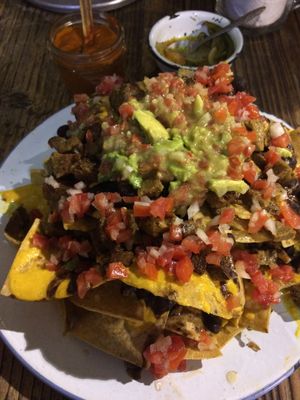 The best vegan nachos in Mexico City - these are so spectacular!!! The cheese alternative was incredible, there's so much guac, beans... everything was delicious! at Temictli - Hipodromo in Mexico City