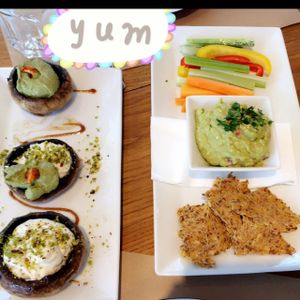stuffed mushrooms w/ pesto and cashew cream and guacamole with crackers  at Yi in Athens
