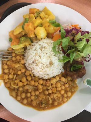 Daily menu, rice, chickpea stew, bean patty, veggies in creamy pumpkin sauce, salad at Mennyorszag Szive in Budapest