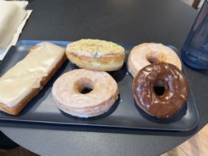 Maple bar, two original glazed, chocolate impossible (vegan, GF), Alice in wonderlandd  at Guru Donuts in Boise