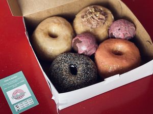 Original glazed, chocolate peanut butter bomb, strawberry lemonade, chocolate coconut, raspberry chocolate nibbler  at Destination Donuts in Columbus