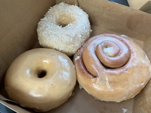 My haul! Glazed, coconut and cinnamon roll flavors 😋  at Destination Donuts in Columbus