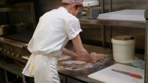 rolling out fresh flat bread at Kismet Falafel in Los Angeles