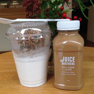 A delicious breakfast: coconut yoghurt with granola and a cold brew latte at JuiceBrothers - Van Woustraat in Amsterdam