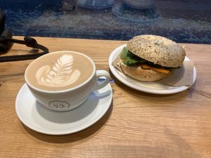 Latte and salmon/cream cheese bagel  at Cafe Neundrei in Berlin