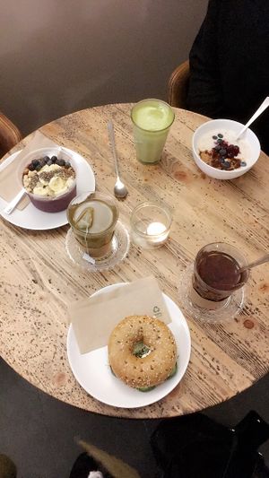 A bagel, oatmeal, and an acaii bowl at Cafe Neundrei in Berlin