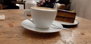 Cappuccino with soy milk and vegan cake at Cafe Neundrei in Berlin