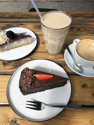 Banana Peanut Smoothie, Cappuccino, Poppyseed Cake and Chocolate Cherry Cake! Everything was really good, especially the raw vegan cakes!  at Cafe Neundrei in Berlin