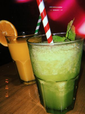 Natural juice with lemon, mint and ginger and fresh pressed orange juice  at Baobab in Zaragoza