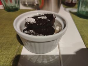 Dessert Bedda Matri: tortino al cioccolato fondente (con ingrediente segreto!) e semifreddo al cocco (disponibile anche in altri gusti) con topping di caramello salato at Spinno in Palermo