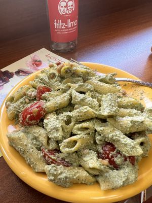 Delicious home made gluten free pesto pasta with cherry tomatoes   at Loving Hut in Sofia