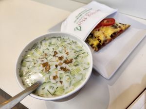 Tarator soup and pizza slice at Loving Hut in Sofia