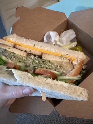 veggie sandwich w veganaise, violife cheddar, marinated tofu & all the veggies on sourdough bread  at Skagit Valley Food Co-op in Mount Vernon