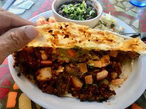 The soyrizo / potato quesadilla, accompanied by pico de gallo, black beans and chopped lettuce. at Crossroads Cafe in Joshua Tree