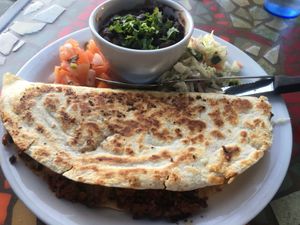 The soyrizo / potato quesadilla, accompanied by pico de gallo, black beans and chopped lettuce. at Crossroads Cafe in Joshua Tree