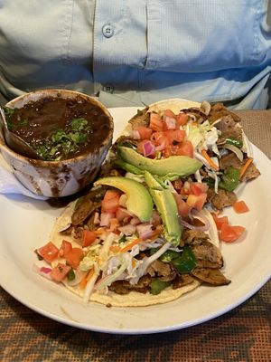 hot as hell tacos with side of black beans.   at Crossroads Cafe in Joshua Tree