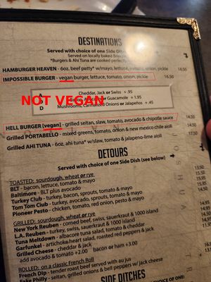 Neither the Hell Burger nor the Impossible Burger are vegan despite being labeled as such on the menu. at Crossroads Cafe in Joshua Tree