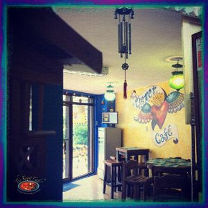 Philippine nipa hut, masks from Mexico and Nepal, metal wind chimes from China & squash lamps from India. (Early days, before we painted the murals!) at The Kismet Cafe in Makati