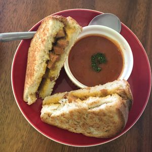 Vegan ham and cheese sandwich served with tomato soup at The Kismet Cafe in Makati