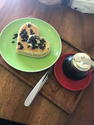 Vegan chocolate chip pancakes served with syrup at The Kismet Cafe in Makati