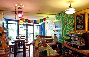 Brightly colored murals and artifacts light up the cozy space. at The Kismet Cafe in Makati