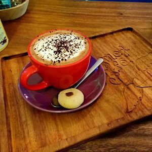 Hot cappuccino and a cool cookie! at The Kismet Cafe in Makati