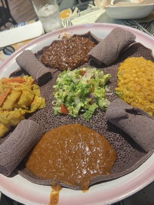 Listed as vegetarian/vegan on the menu, the combo platter is vegan and feeds 2-4 people easily!  You can substitute the injera (bread) for gluten-free as well!   at Queen of Sheba in Spokane