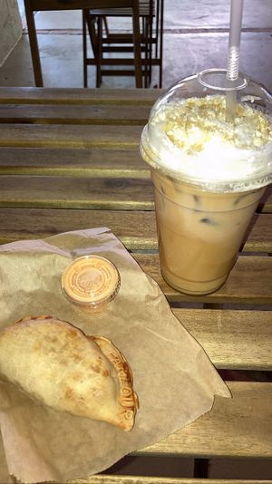 Brown sugar latte & empanada   at Parlour Vegan Bakery in Plantation