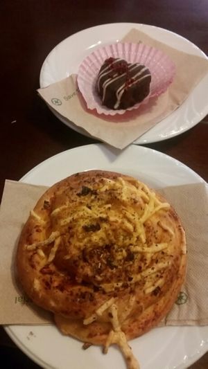 Pizza bun and red velvet mini cake purchased from Bonchaz cafe at Vogue Cakes in Vancouver