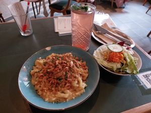 Vegan "Käsespätzle" served with side salad at Cafe Rost in Mannheim