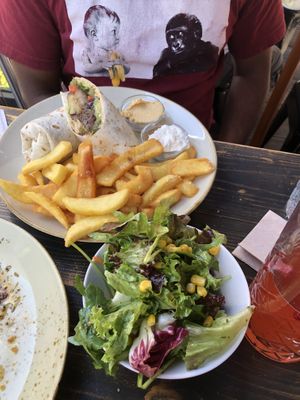 grilled veggie wrap with fries, side salad and dips   at Cafe Rost in Mannheim