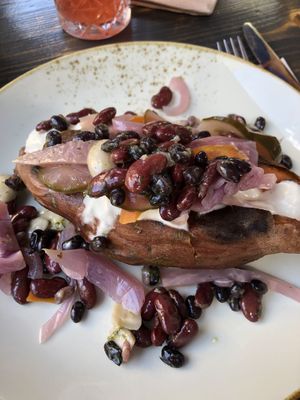 Stuffed sweet potato with beans and pickles   at Cafe Rost in Mannheim