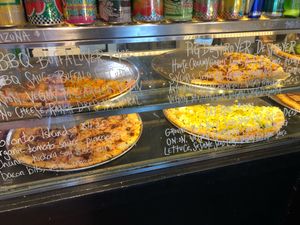 Ready made pizzas by the slice  at Apiecalypse Now Pizza and Snack Bar in Toronto