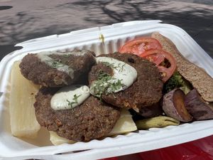 3 burger paddies, yuca, pasta, sweet potato, and salad  at Prem Vida - Alimentación Consciente in Sucre