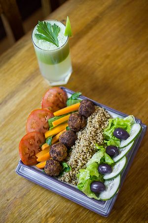 The Buddah Bowl with a detox juice. I'm a traveling photographer and thought I'd snap a shot of my bowl for Prem. They're really amazing people doing incredible things for the community! at Prem Vida - Alimentación Consciente in Sucre