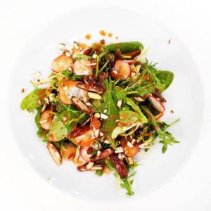Our Exotic Salad
with baby arugula, lettuce, baby spinach, dates, roasted almonds, radishes and peach dressing. at Mama Tierra in Athens