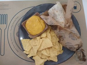 Mushroom melt wrap with nachos and vegan cheddar sauce at Mama Tierra in Athens