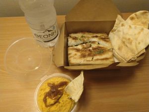 Moussaka and hummus (delivery) at Mama Tierra in Athens