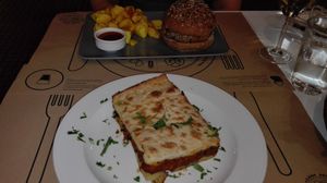 Burger and moussakas at Mama Tierra in Athens