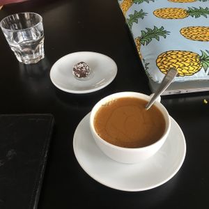 Coffee and Raw Chocolate Ball. at Cargo Coffee and Kitchen in Helsinki