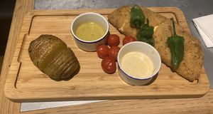 Seitan with’gouda and red pepper centre, hasleback potato and sauces at Teresa Carles Cocina Vegetariana in Barcelona