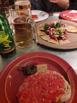 Starters nachos and tomatoes on bread.  at Teresa Carles Cocina Vegetariana in Barcelona