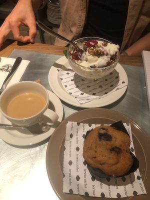 Coffee with oat&coconut milk, blueberry muffin and soy yoghurt parfait.  at Teresa Carles Cocina Vegetariana in Barcelona