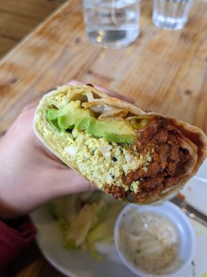 bacon and tofu scramble wrap with avocado added at Anna Loka in Cardiff