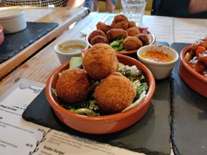 Risotto and fried pickles behind that at Anna Loka in Cardiff